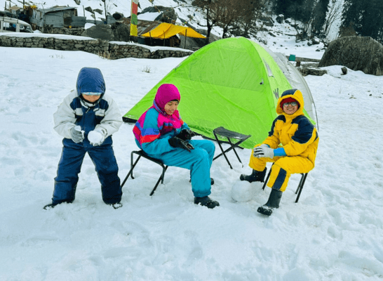 Three children in colorful winter outfits